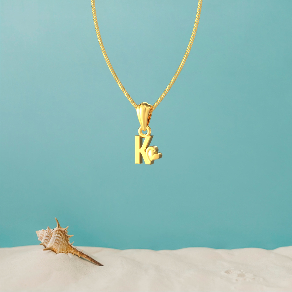 Gold K initial pendant with a lovely heart design